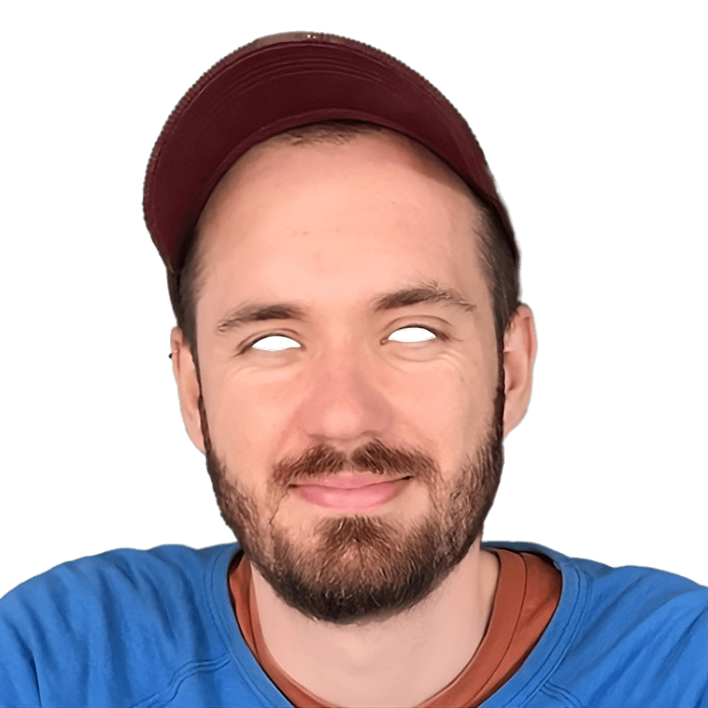 Luke Meyrick, smiling, in a maroon cap and blue jumper